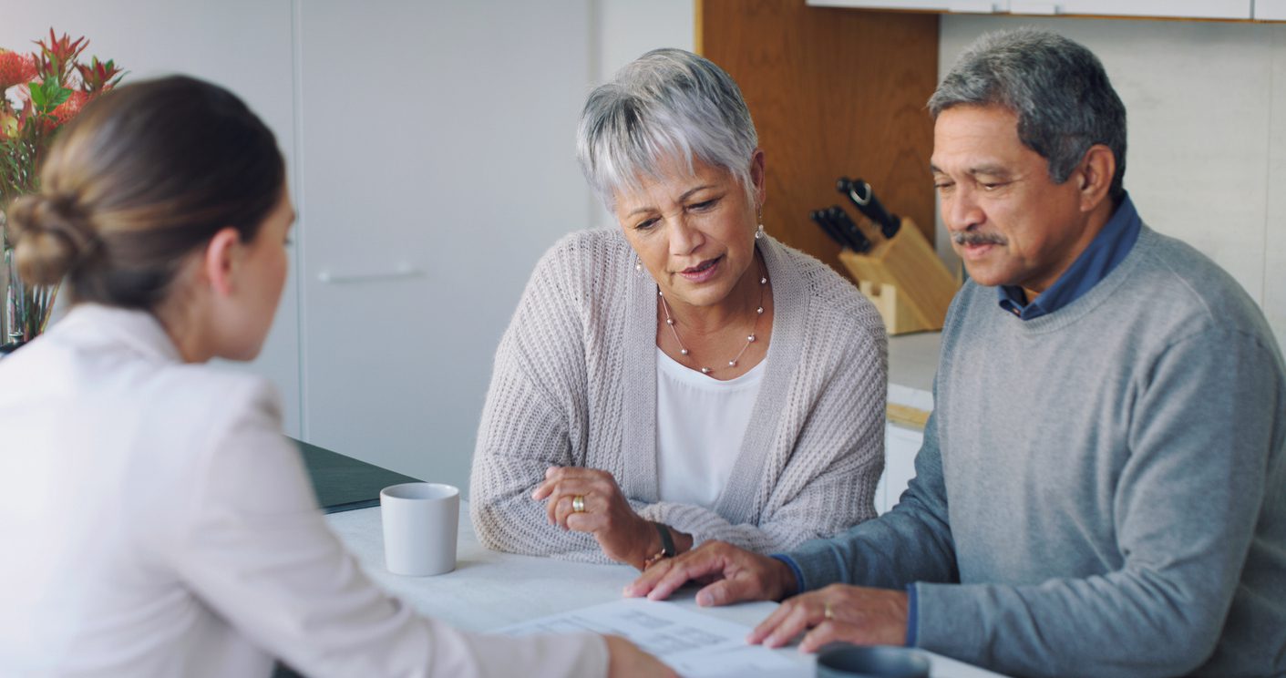 TaxRise advisor reviewing documents with clients during a consultation